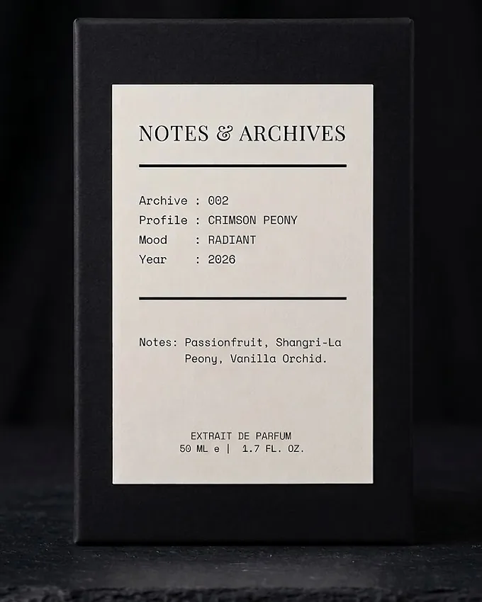 The rigid slider box for Archive 002: Crimson Peony, its cream label printed with the archive number, profile, mood and notes.